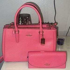 Michael Kors hot pink hand/ crossbody bag with matching wallet.